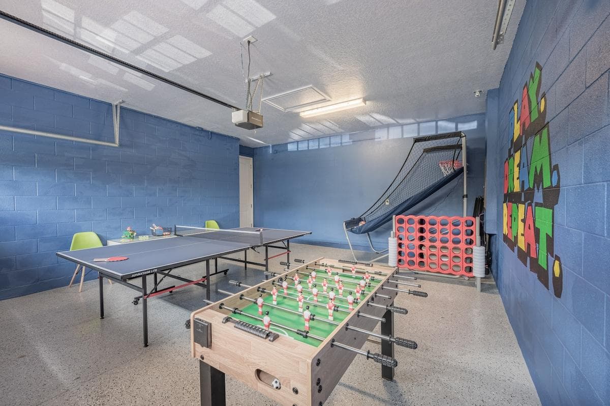 Game room located in the garage. Foosball, ping pong, arcade basketball, poker set & board games — fun for all ages!